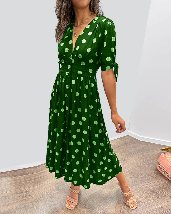 Dress with deep V-neck and polka dots