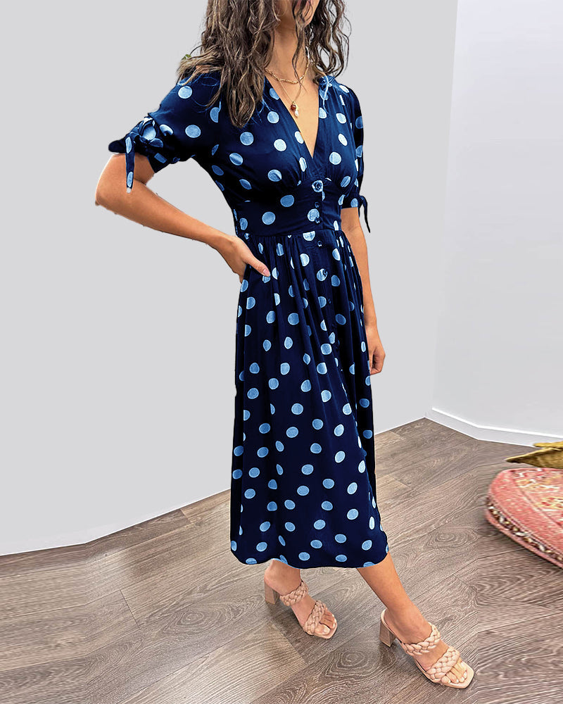 Dress with deep V-neck and polka dots