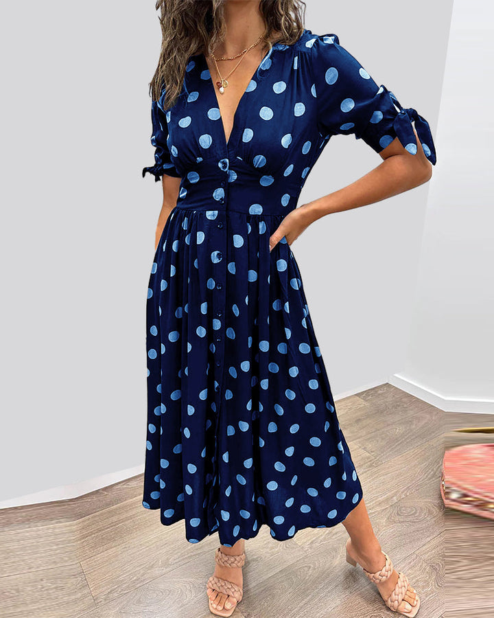 Dress with deep V-neck and polka dots